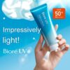 Applying Biore UV Aqua Rich Watery Essence on Skin